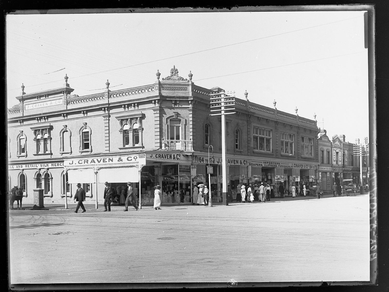 J. Craven and Co's signs along the corner of Rundle and Pulteney Streets, Adelaide